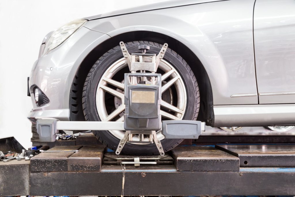 A close up of car getting a wheel alignment