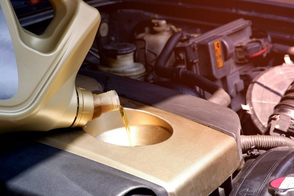 pouring engine oil