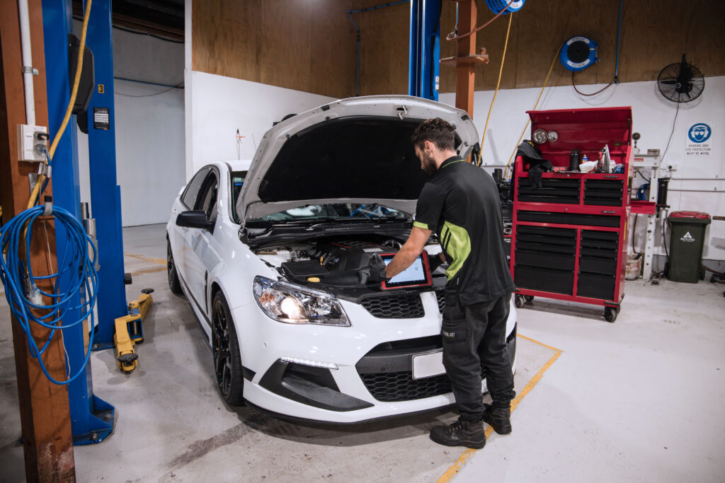 mechanic checking battery
