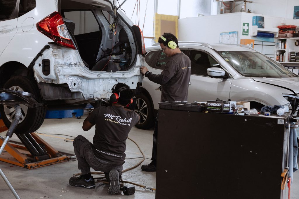 2 mechanics panel beating