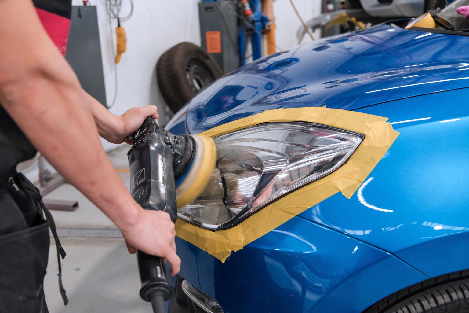 front car headlights getting cleaned