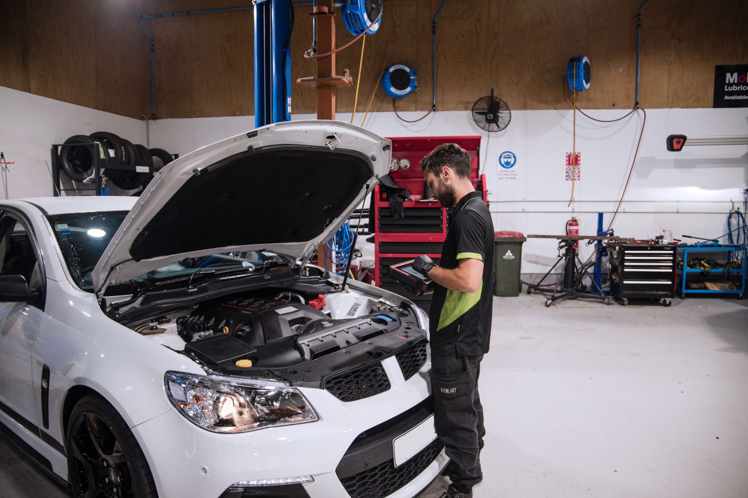 mechanic taking notes of wof check